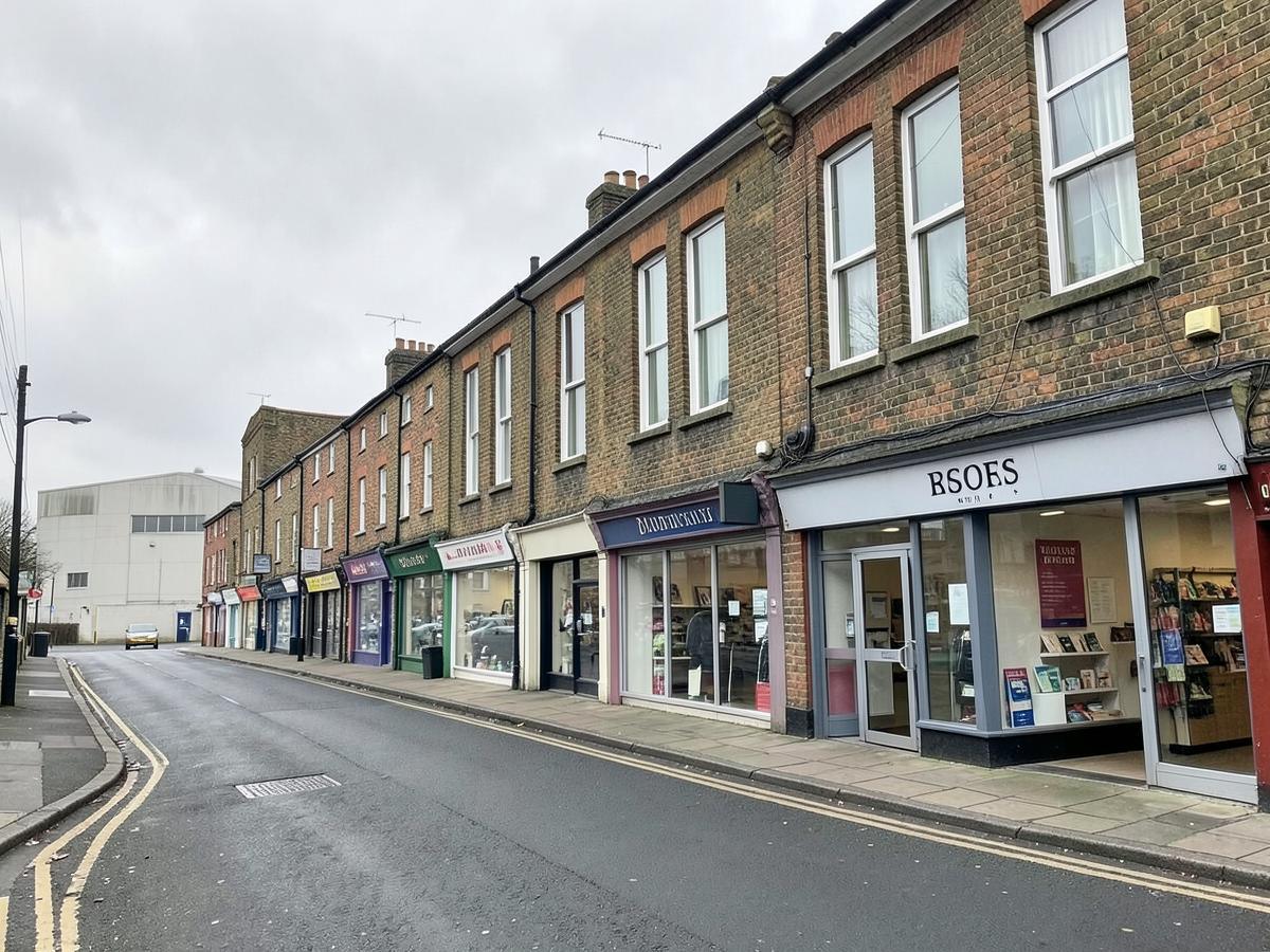 British high street retail parade with brick upper floors